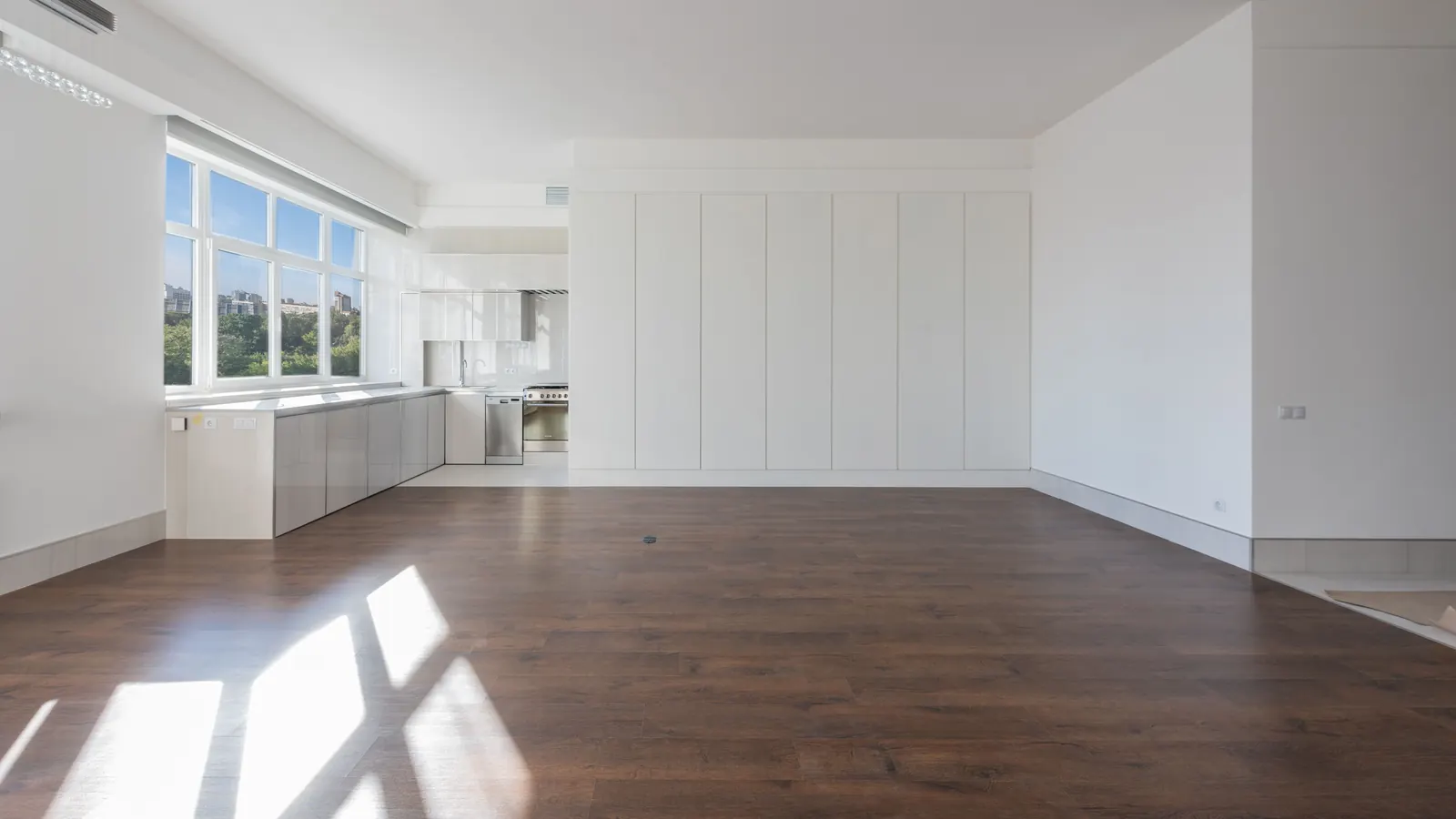 Bright, spotless newly finished apartment with white cabinetry and hardwood floors